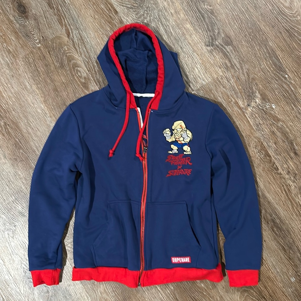 Superare Fight Goods x Street Fighter SF Sagat Muay Thai Blue Full Zip Hoodie